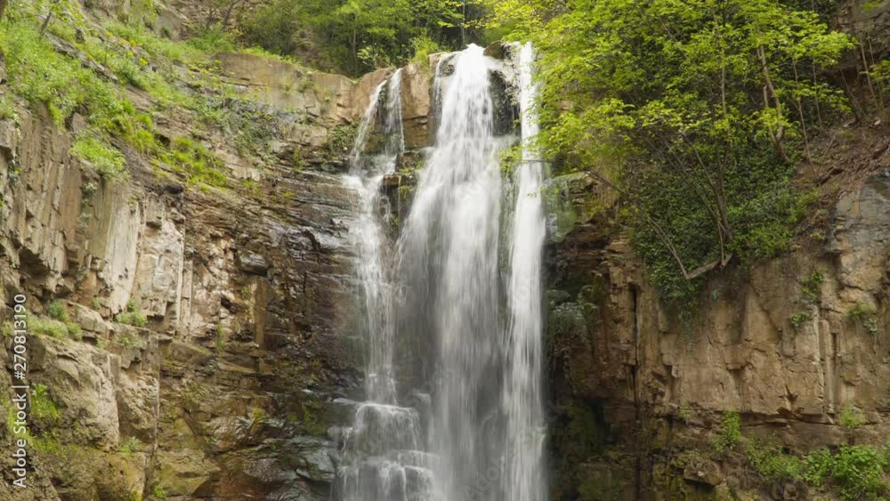 View of the beautiful waterfall among the rocks. View of the beautiful waterfall among the rocks.
