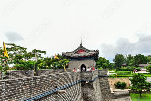 Ancient buildings at the beginning of the Great Wall in photo