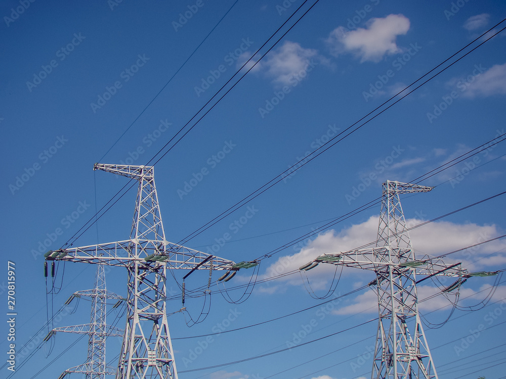 High voltage electrical line. Electricity metal pylon. Wires, glass insulators, metal.