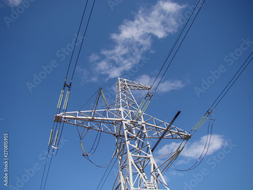 High voltage electrical line. Electricity metal pylon. Wires, glass insulators, metal.