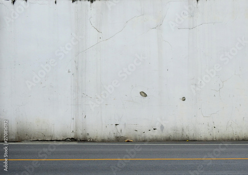 aged street wall with asphalt road texture background