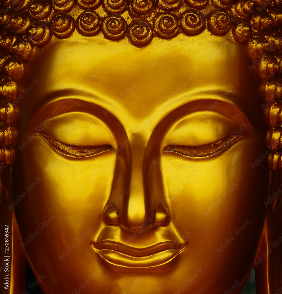 gold buddha face statue