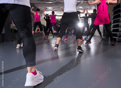 Fototapeta Naklejka Na Ścianę i Meble -  sporty women doing aerobics exercises
