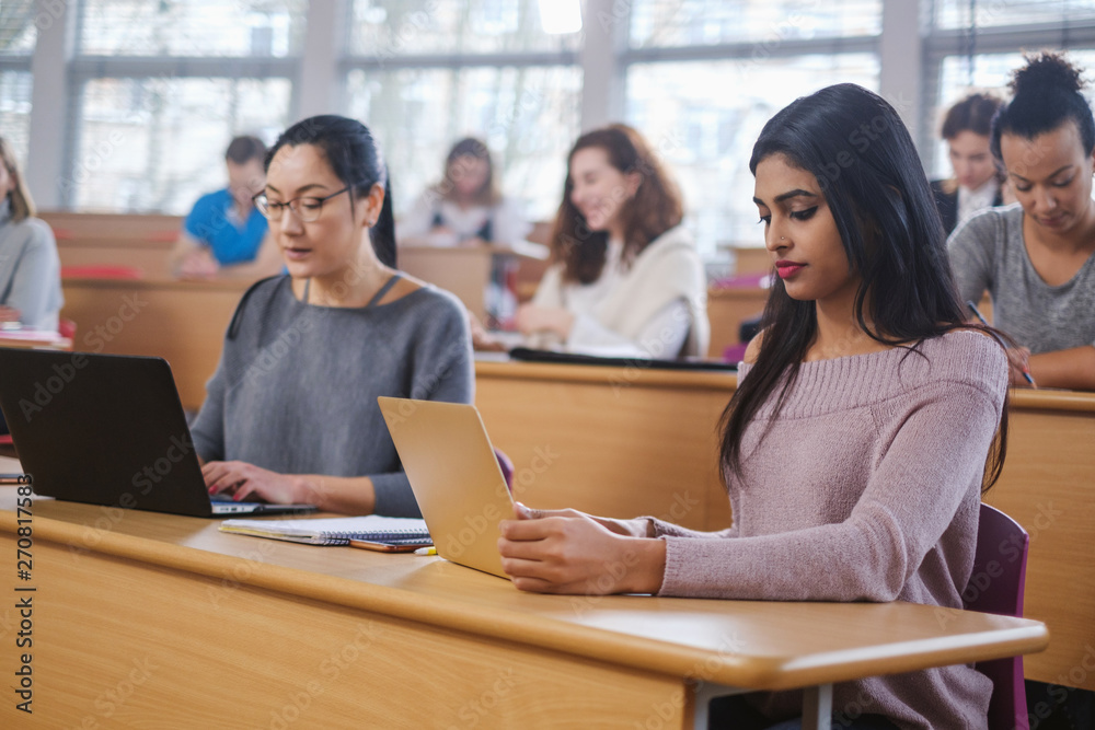 Multinational group of students in an auditorium Multinational group of students in an auditorium