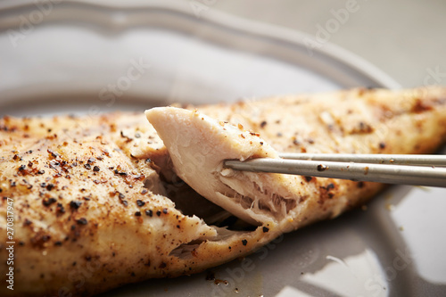 Grilled mackerel fish, eating with chopsticks