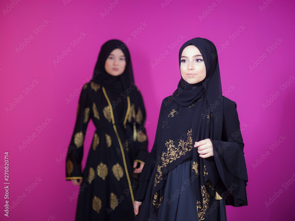 two hijab muslim woman on pink background two hijab muslim woman on pink background
