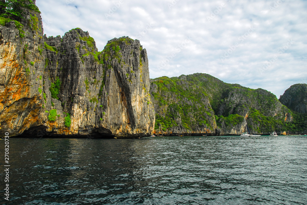 Rocky walls, with crystal clear waters near Maya bay, Ko Phi Phi island, Phuket, Thailand