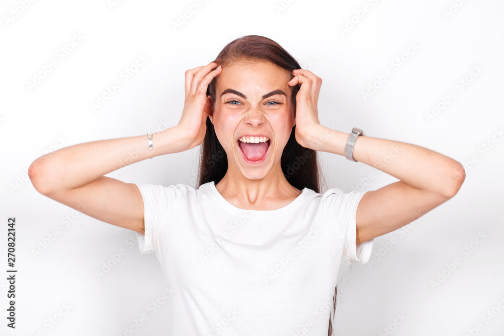 Young beautiful girl screaming in the studio Young beautiful girl screaming in the studio