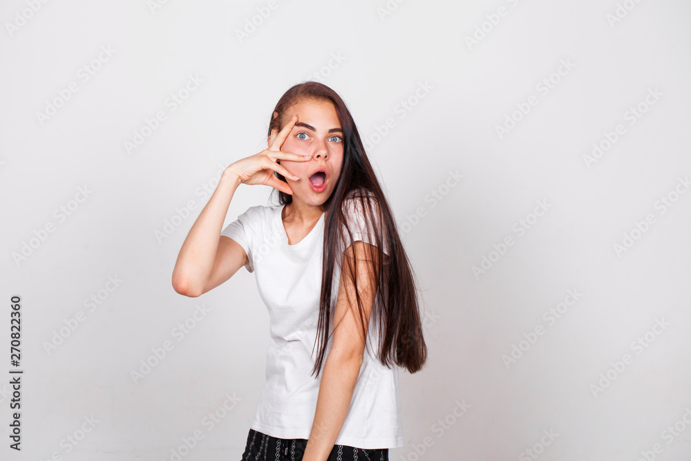 Young woman covers her face arms Young woman covers her face arms