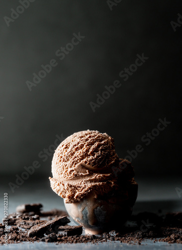One scoop of Chocolate Ice cream on table with chiaroscuro picture style with copy space for add text.