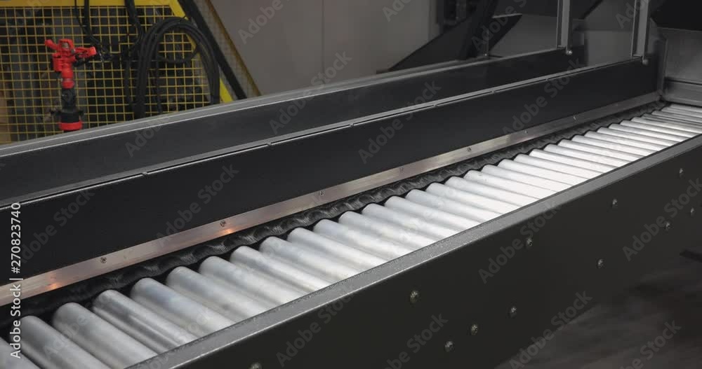 Long Metal Conveyor Rollers at Production Line Empty Long Metal Conveyor Rollers at Production Line Empty