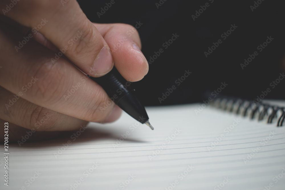 People are writing books with pen. Clouse up. People are writing books with pen. Clouse up.