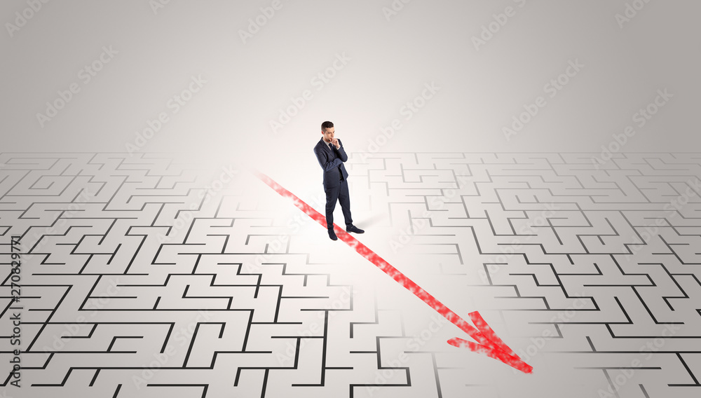 Businessman going through the maze with red arrow
Businessman going through the maze with red arrow