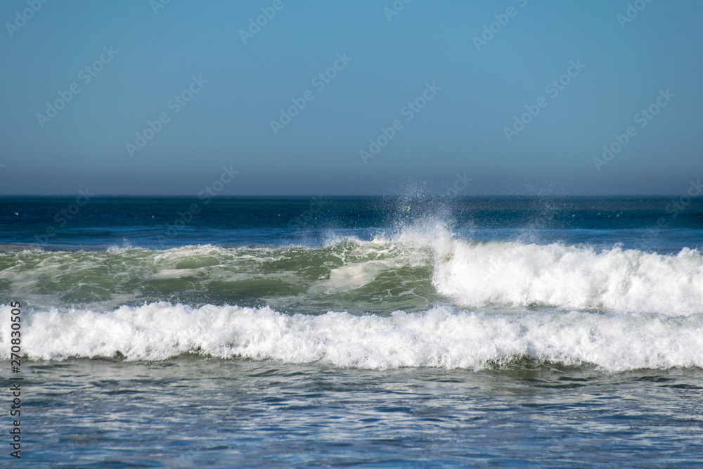 atlantic ocean waves breaking onto beach in Agadir,, Morocco
