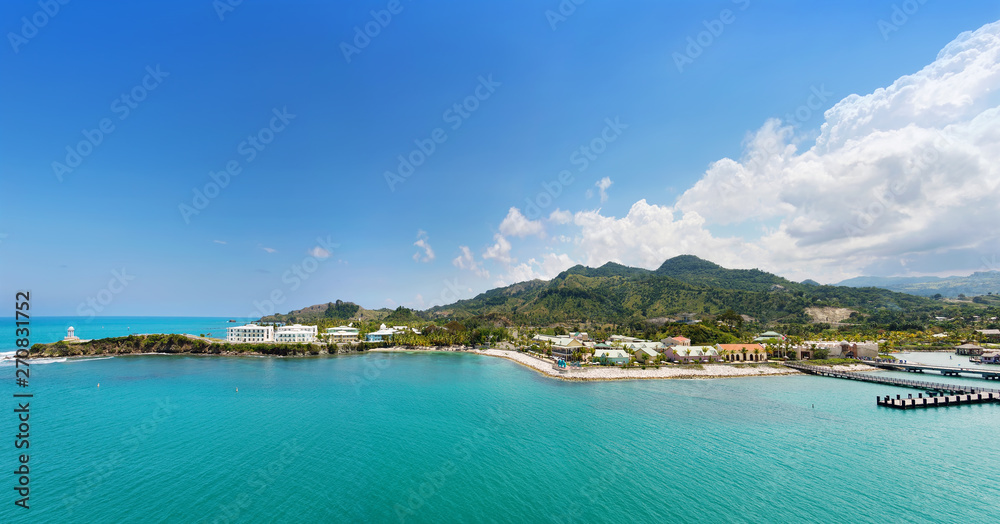 Panorama of tropical resort Amber Cove with pier for cruise ships  and resort on sunny day