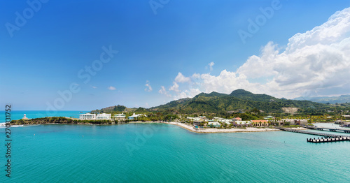 Panorama of tropical resort Amber Cove with pier for cruise ships and resort on sunny day