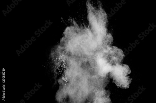 White talcume powder explosion on black background.