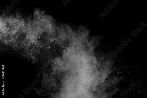 White talcume powder explosion on black background.