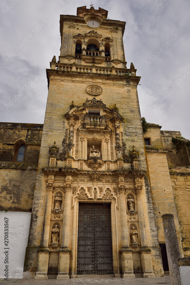 Front door and bell tower of Saint Peter Church in Arcos de la Frontera Spain