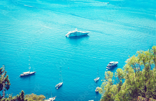 Sea view with sailboat, motor boat from Taormina, Sicily, Italy. © Inna