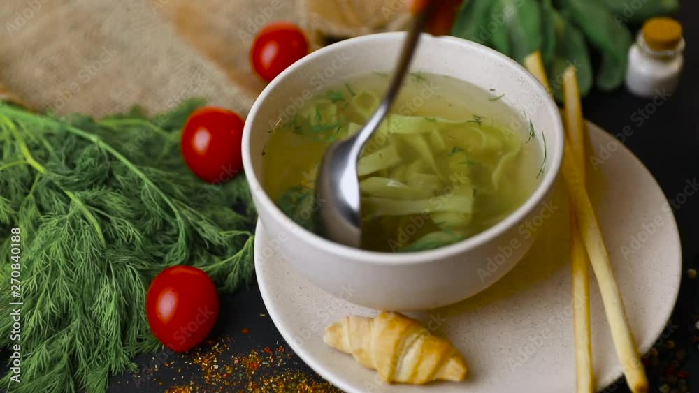 Chicken and potato chowder soup with green bell pepper and carrot in bowls. Healthy food, top view. Black background . Slow-mo Chicken and potato chowder soup with green bell pepper and carrot in bowls. Healthy food, top view. Black background . Slow-mo
