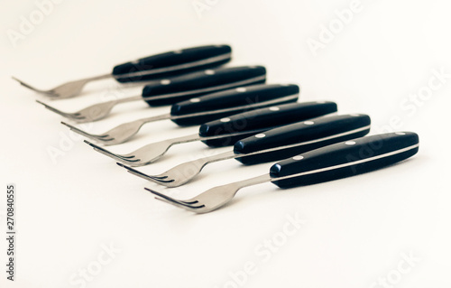 Close up six forks isolated on white background.