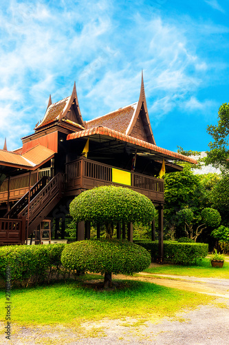 Thai courtyard on the background of an old house.