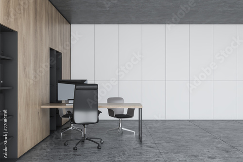 White and wooden office with bookcases