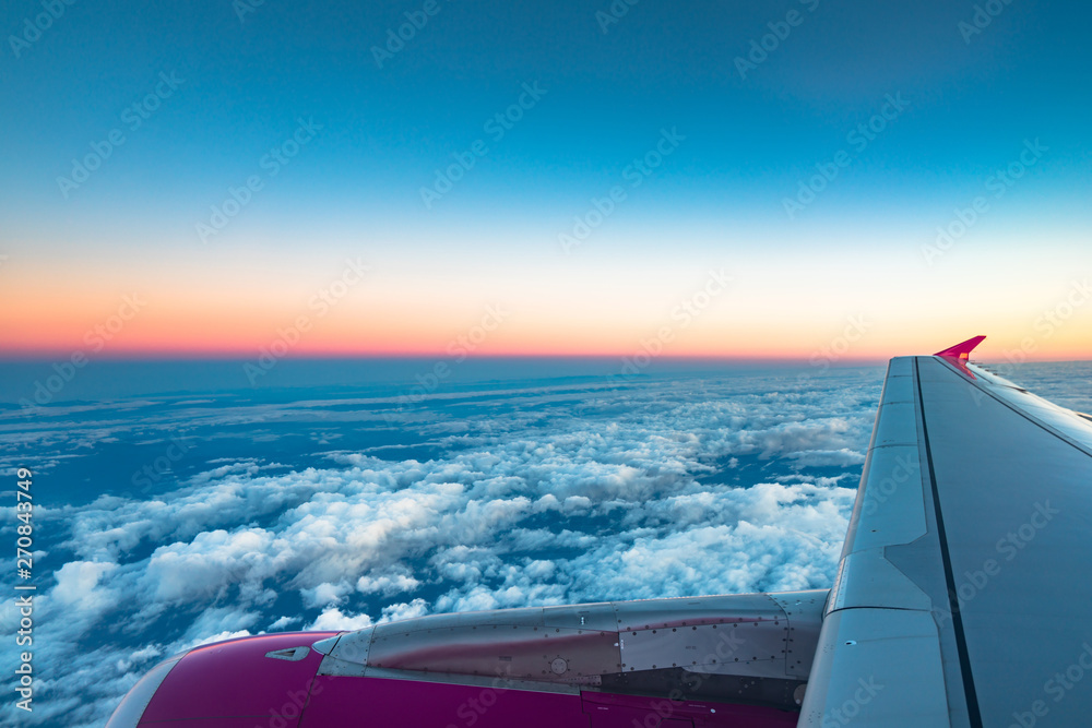 Sunrise view from the window of an airplane flying in the clouds, top view clouds like the sea of clouds sky background, Aerial view background, Yamanashi, Japan