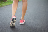 Close up shoes, legs. sport runner woman back view running, girl walking in park..Sport exercise benefit. workout outdoor. weight loss body strong. Slow walking benefits from sport challenge concept.