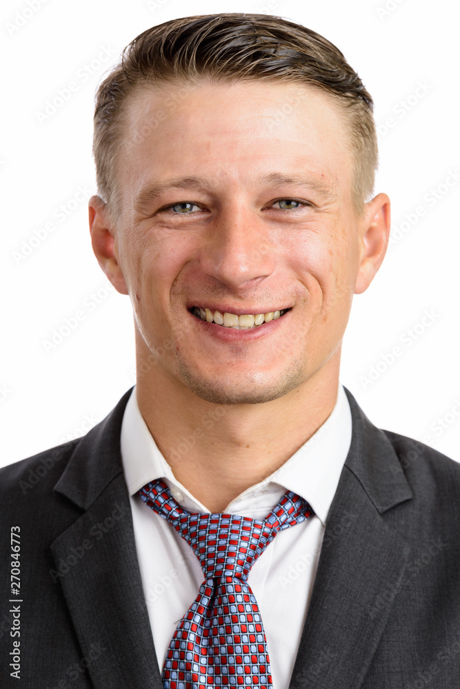 Portrait shot of young happy Caucasian businessman isolated agai Portrait shot of young happy Caucasian businessman isolated agai