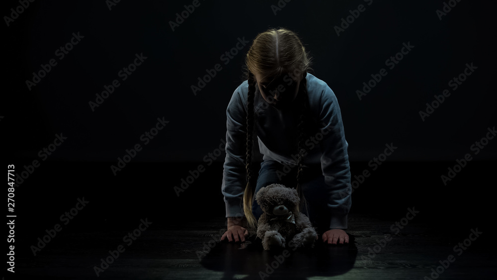 Little girl looking at teddy bear, lonely female kid needs friend, sadness Little girl looking at teddy bear, lonely female kid needs friend, sadness