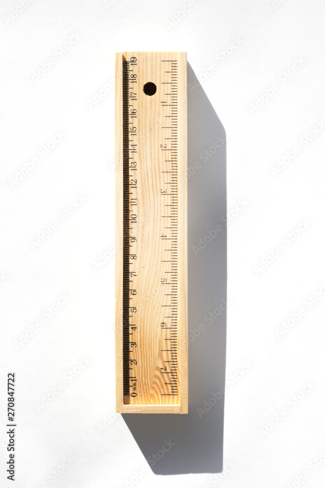 The case with pencils from a natural tree lies on a table. Bright daylight, shadows. Eco-friendly production The case with pencils from a natural tree lies on a table. Bright daylight, shadows. Eco-friendly production