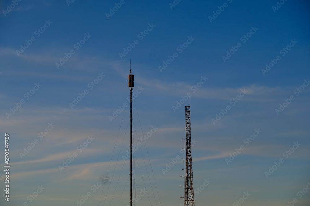 antenna on blue sky with clouds