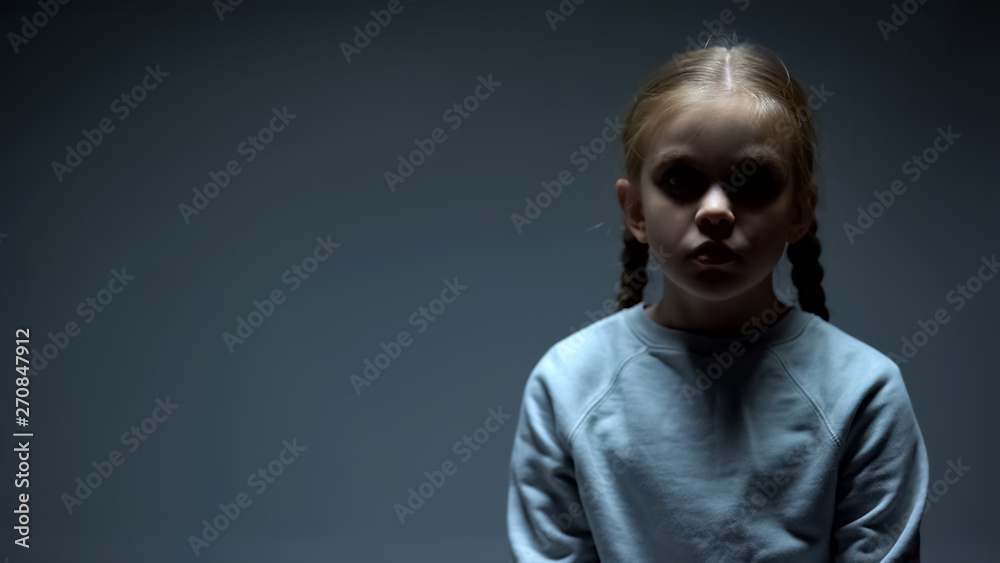 Obraz premium Lonely female child looking at camera, kidnapping victim, social problem