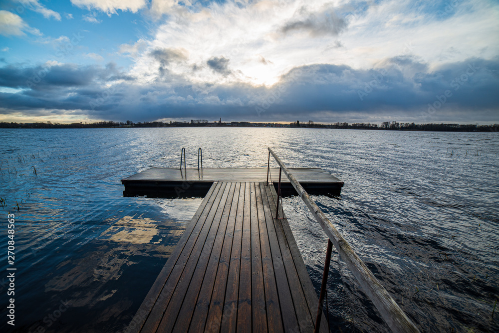 clear sky with dramatic clouds over the lake in sunset clear sky with dramatic clouds over the lake in sunset