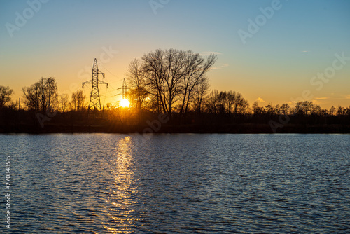 clear sky with dramatic clouds over the lake in sunset