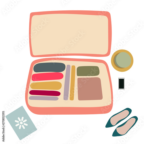 Pink open suitcase with shoes.