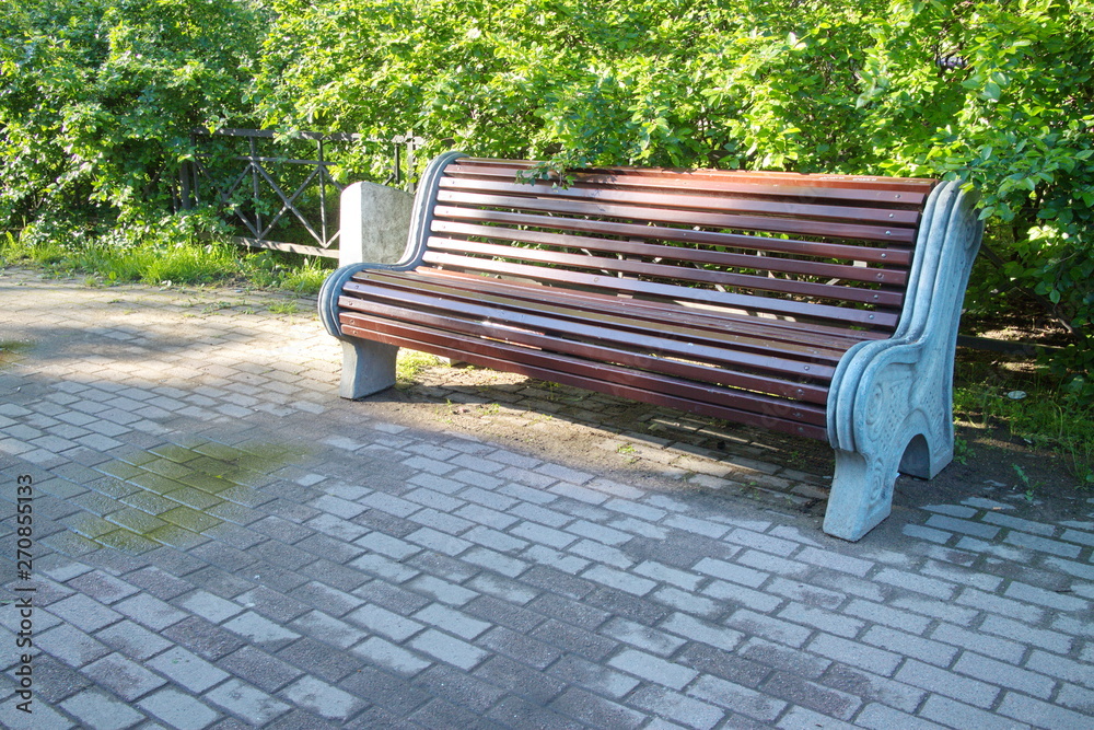Bench in the city courtyard on a sunny morning Bench in the city courtyard on a sunny morning