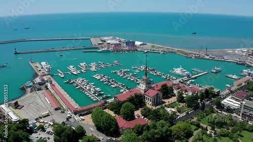 Aerial video shooting. Panoramic view of the sea port of Sochi, Russia. Luxury yachts and boats are in the Bay. The view from the top. City attraction. Black Sea.