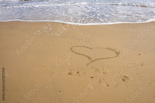 Heart in the sand of italy beach.