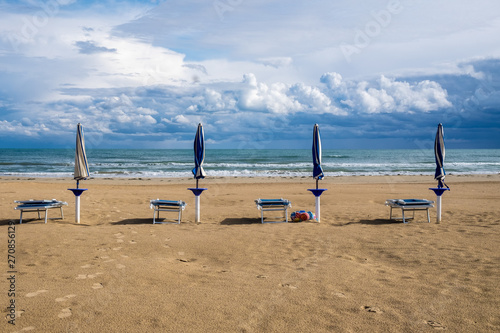 Neach with chairs and umbrellas