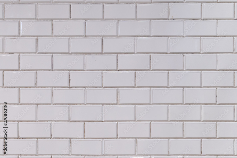 Naklejka premium Old porcelain white tiles background on the station of Budapest M1 Yellow metro line build in art nouveau style