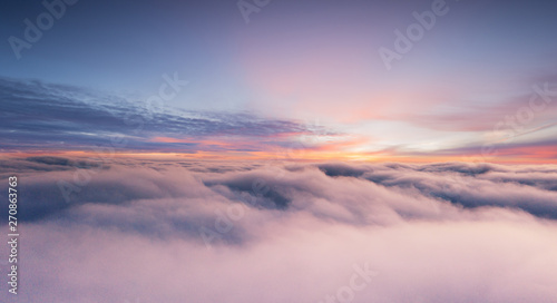 Sunset sky with beautiful clouds from the airplane window