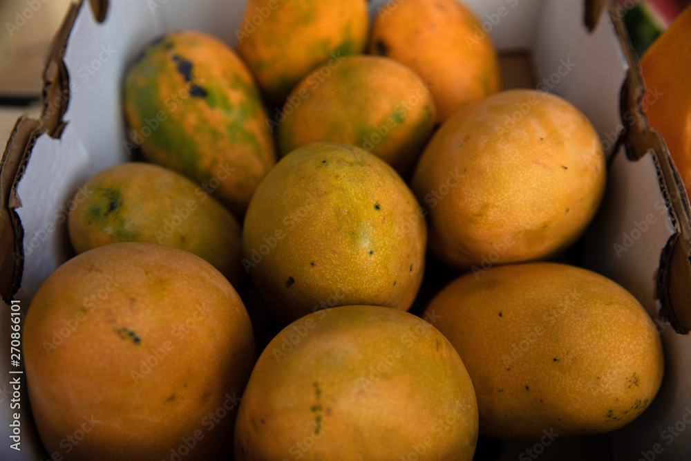 Delicious mangoes in a fruit shop Delicious mangoes in a fruit shop