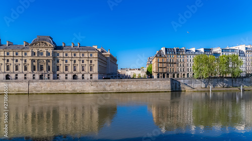 Paris, beautiful houses on the quay, with a view of the Seine, typical facades of the French capital