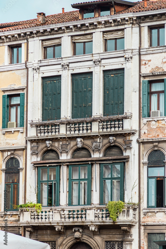 Detail of the facade of the ancient italian building in Venice