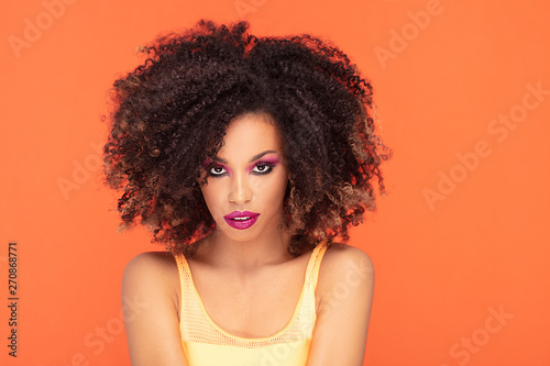 Beauty portrait of afro girl in glamour makeup.