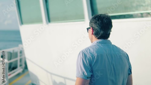 Marine navigational officer during navigational watch on Bridge . Work at sea photo