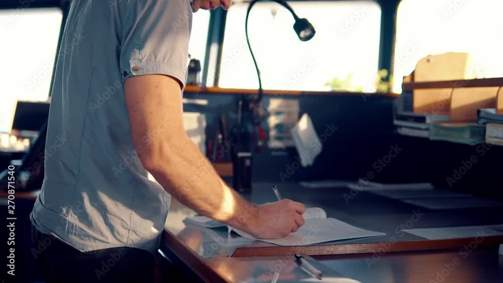 Marine navigational officer during navigational watch on Bridge . He does chart correction of nautical maps and publications. Work at sea Marine navigational officer during navigational watch on Bridge . He does chart correction of nautical maps and publications. Work at sea